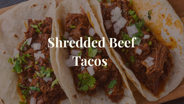 beef tacos with overlay text - shredded beef tacos
